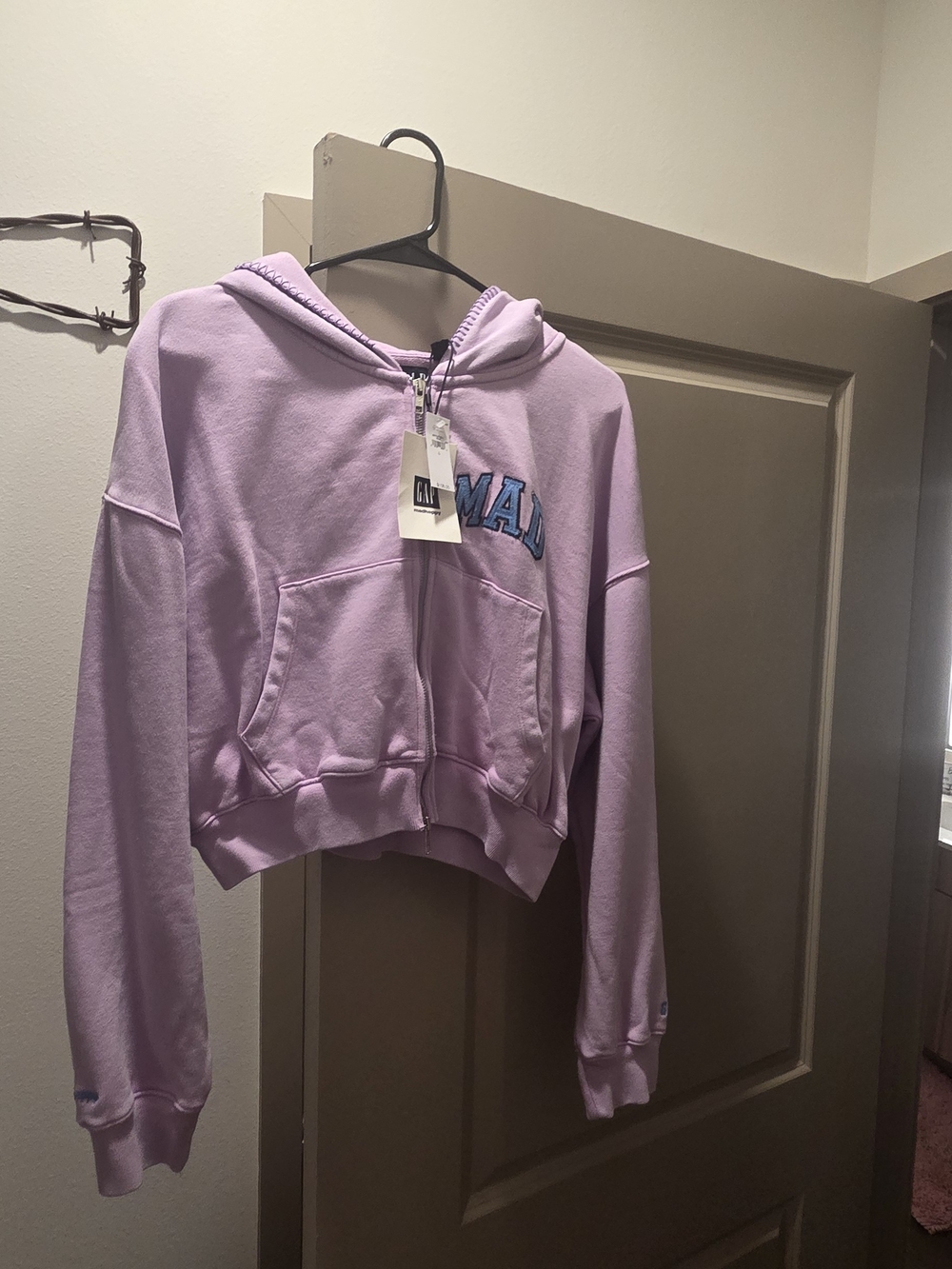 Womens jacket with zipper and tag